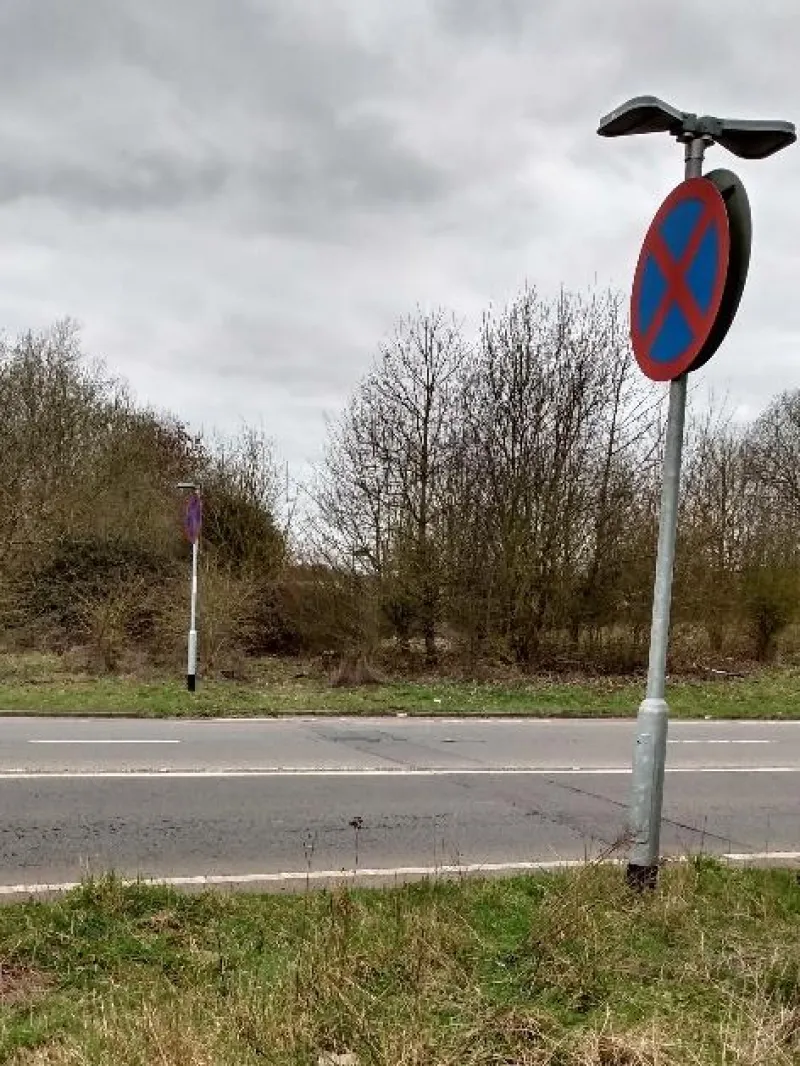 Photo 1. The energy drain is on the other side of the road, 300mm off the curb, 2m to the right of the pole.